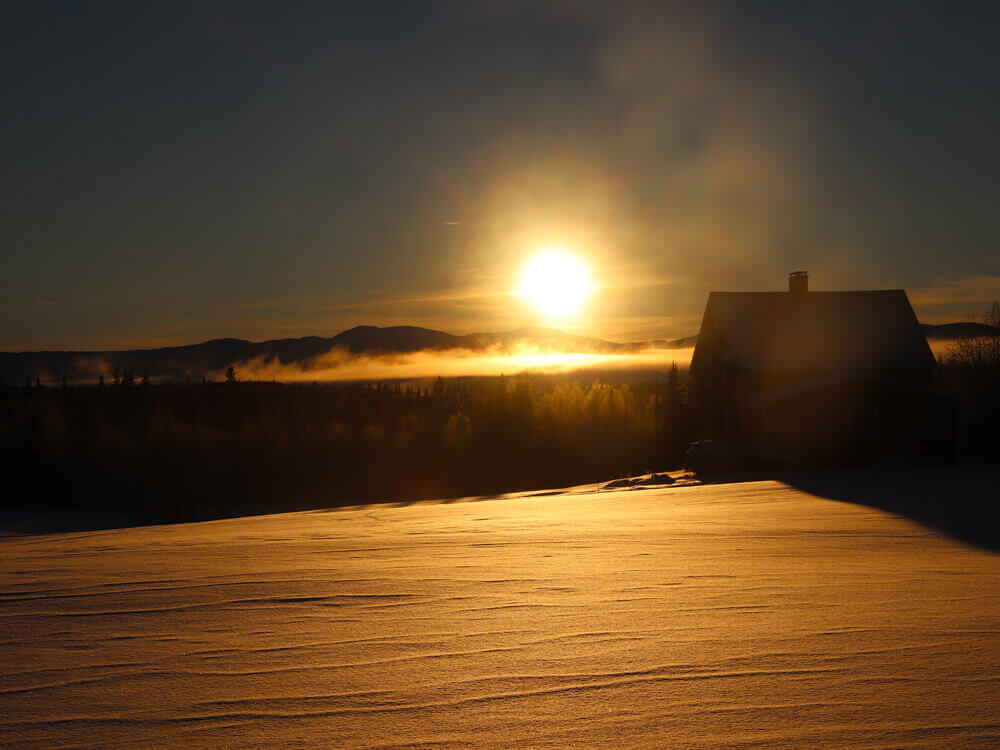 Zonsondergang wintersport Zweden